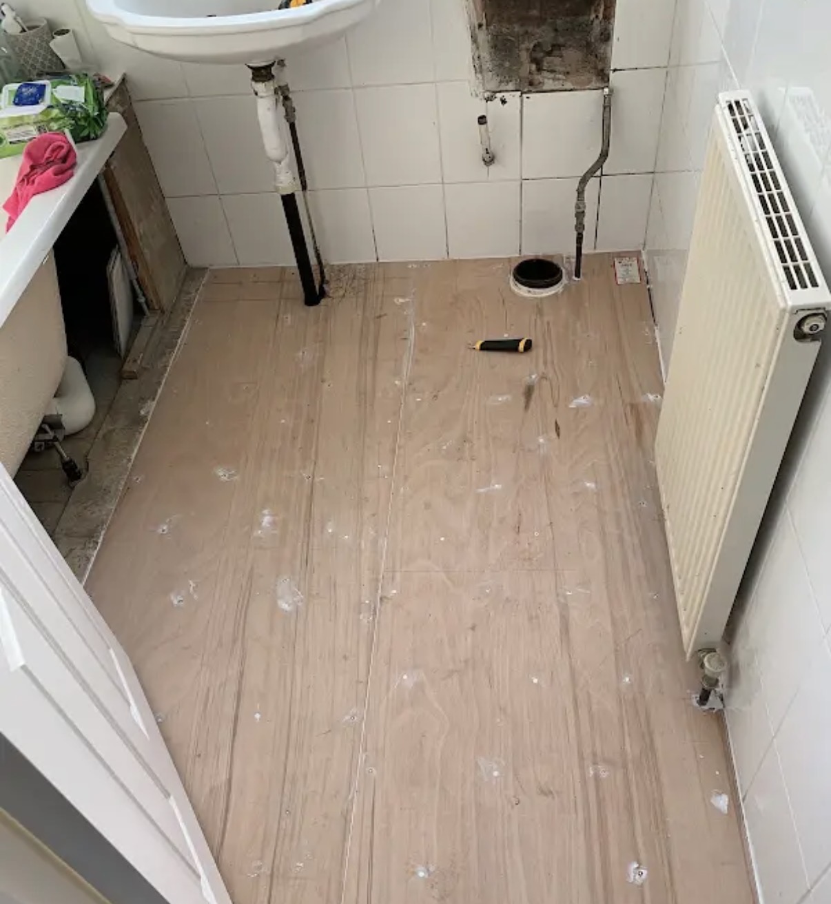 Bathroom floor prepared and tiled during renovation work